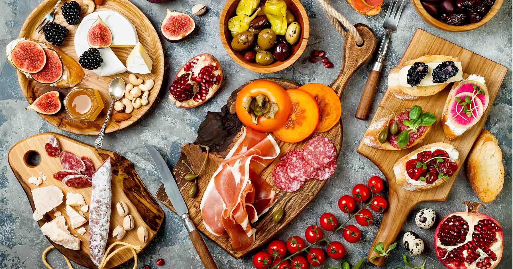 Expansive charcuterie boards with meats, cheeses, fruit and more.